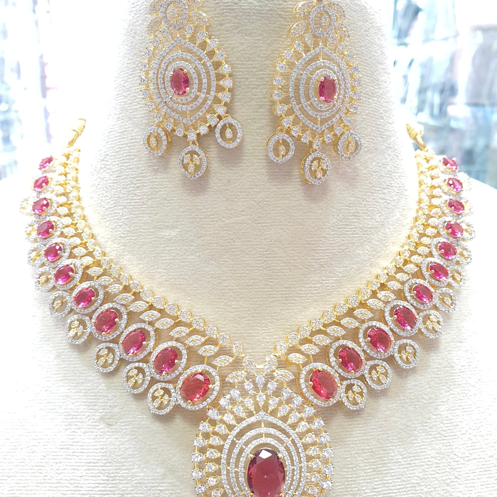 Gold toned bridal necklace with red stones
