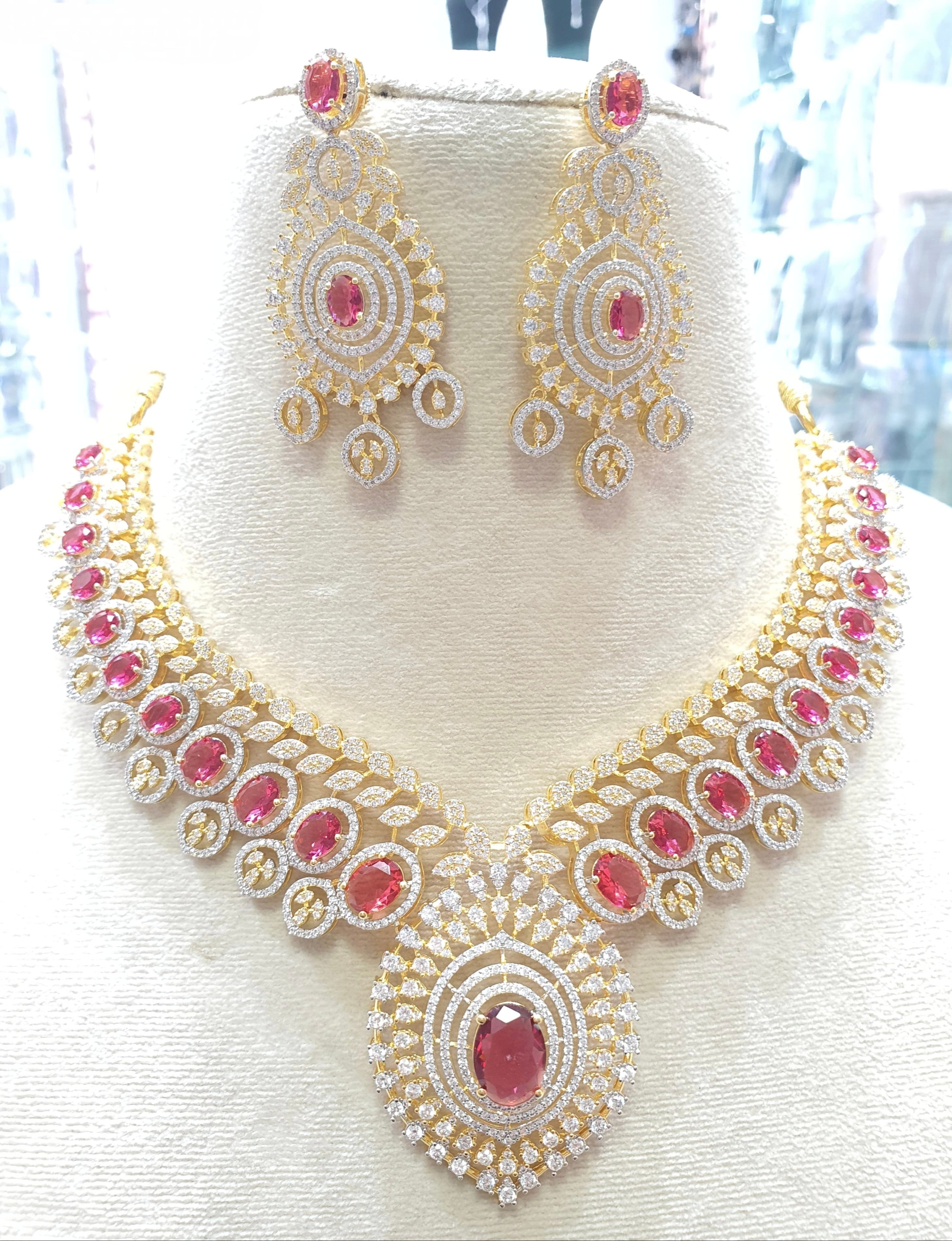 Gold toned bridal necklace with red stones