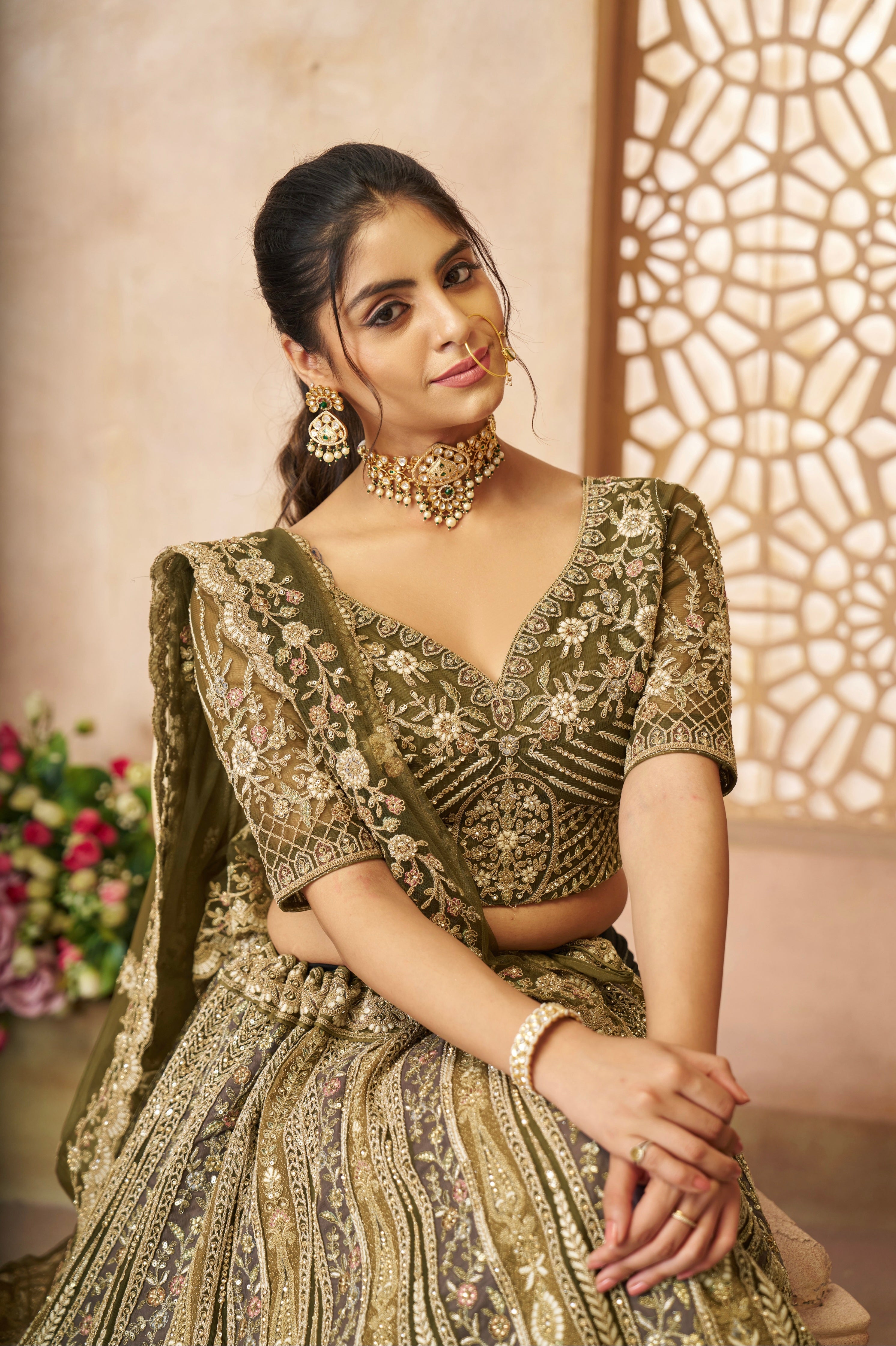Elegant bridal lehenga in mehendi green with heavy embroidery and dupatta