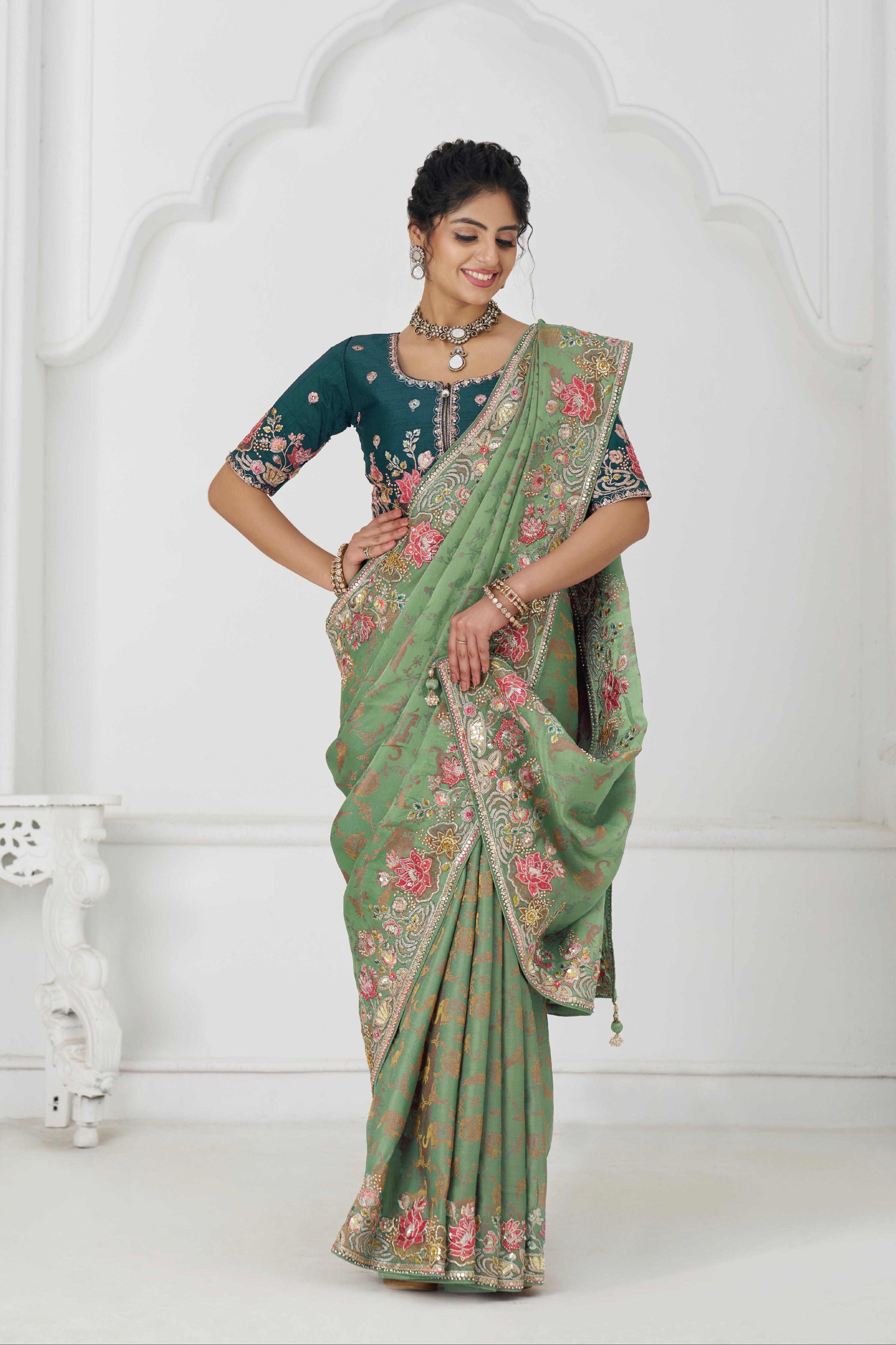 Green embroidered silk saree for festive wear