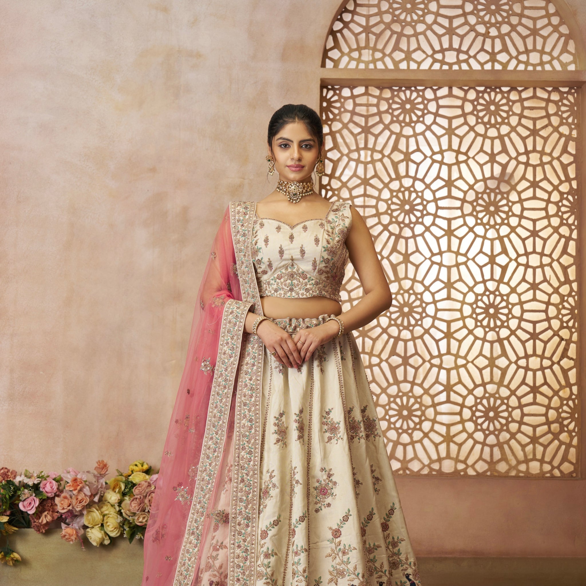 White zari silk bridal lehenga with pink net dupatta and heavy embroidery