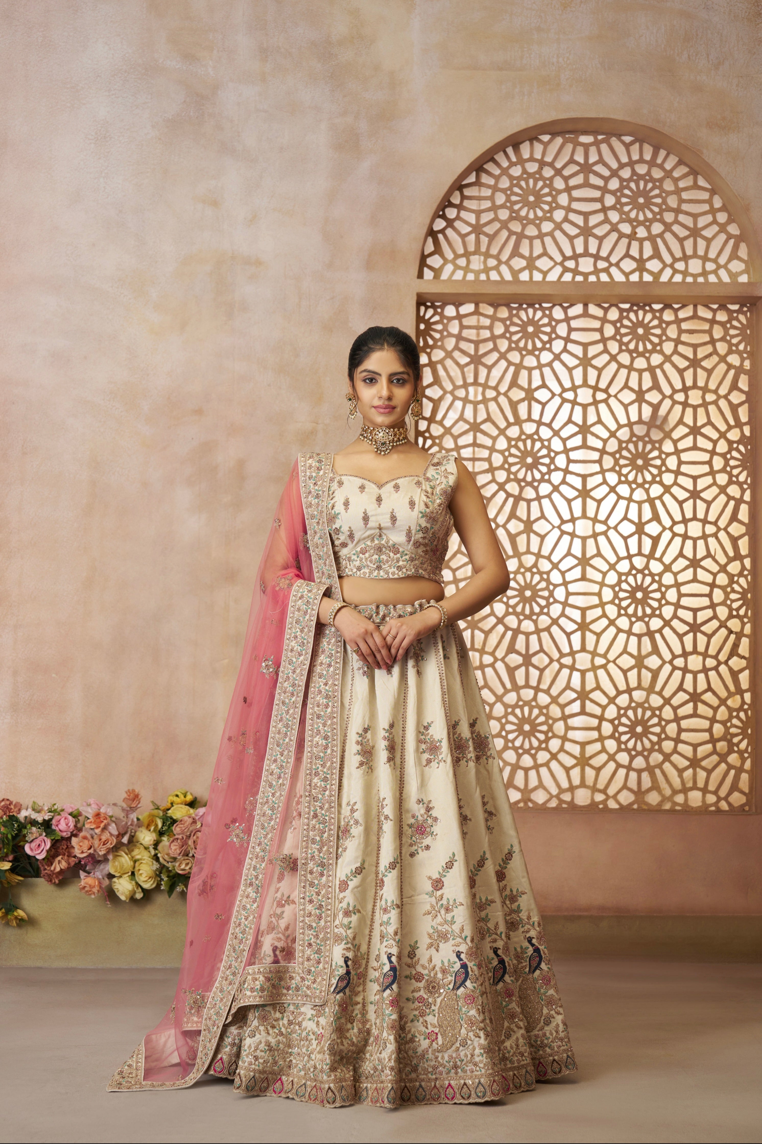 White zari silk bridal lehenga with pink net dupatta and heavy embroidery