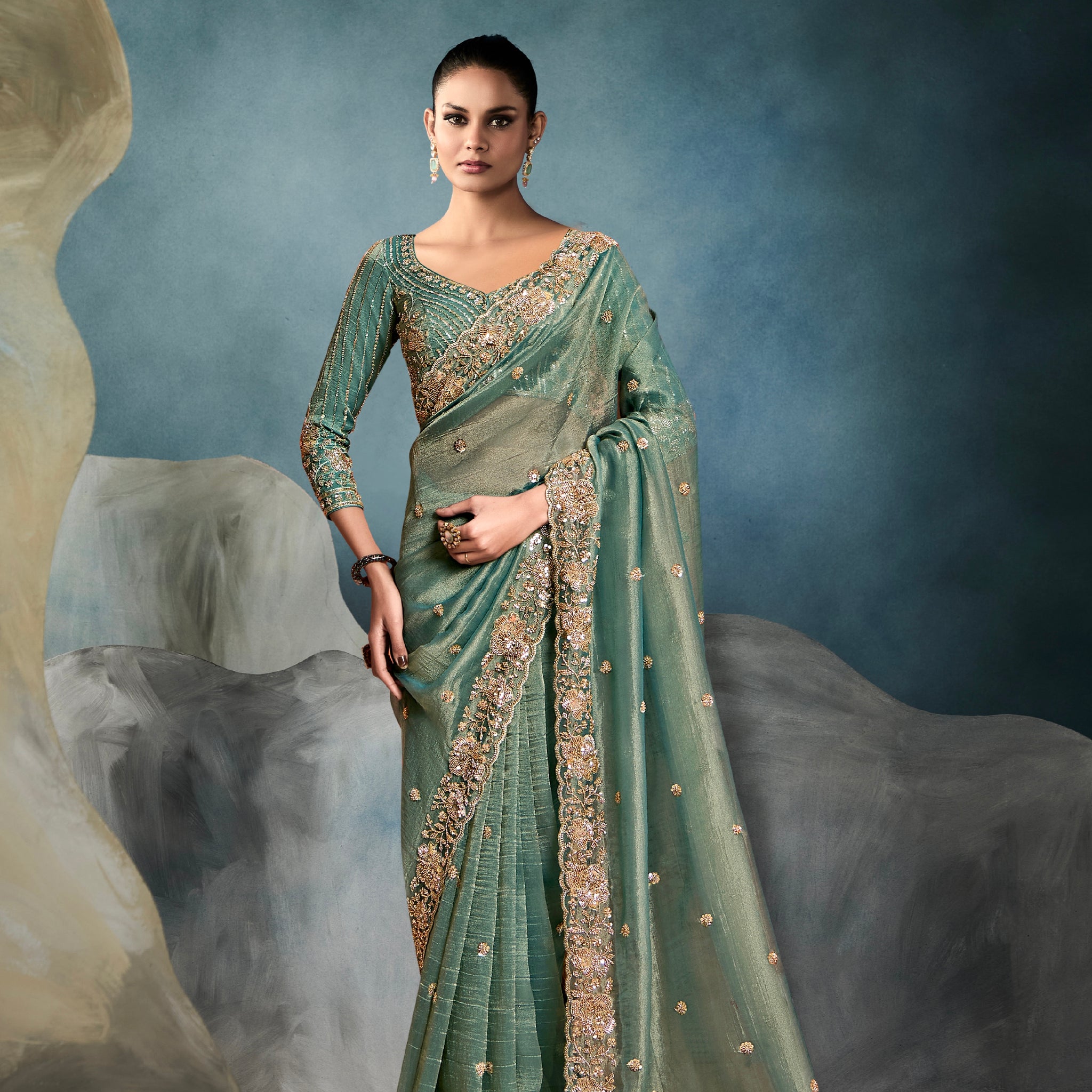 Sage green tissue saree with hand embroidery work