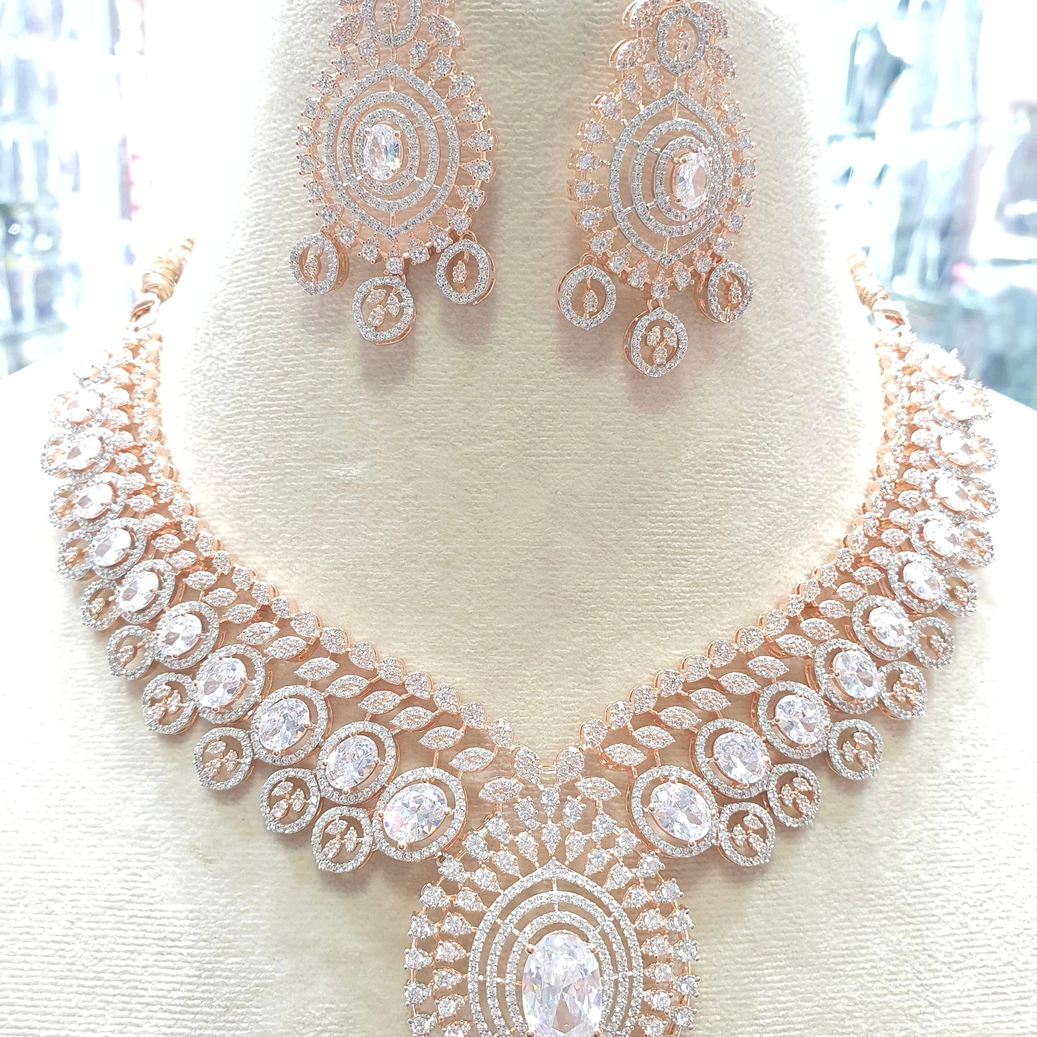 Rose gold necklace with clear stones and earrings