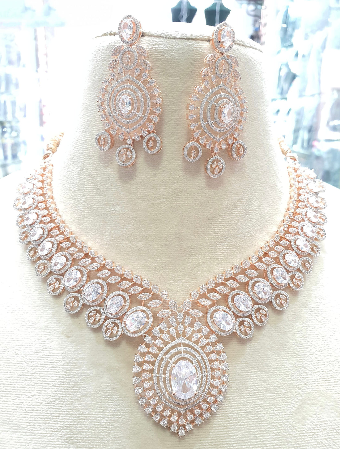 Rose gold necklace with clear stones and earrings