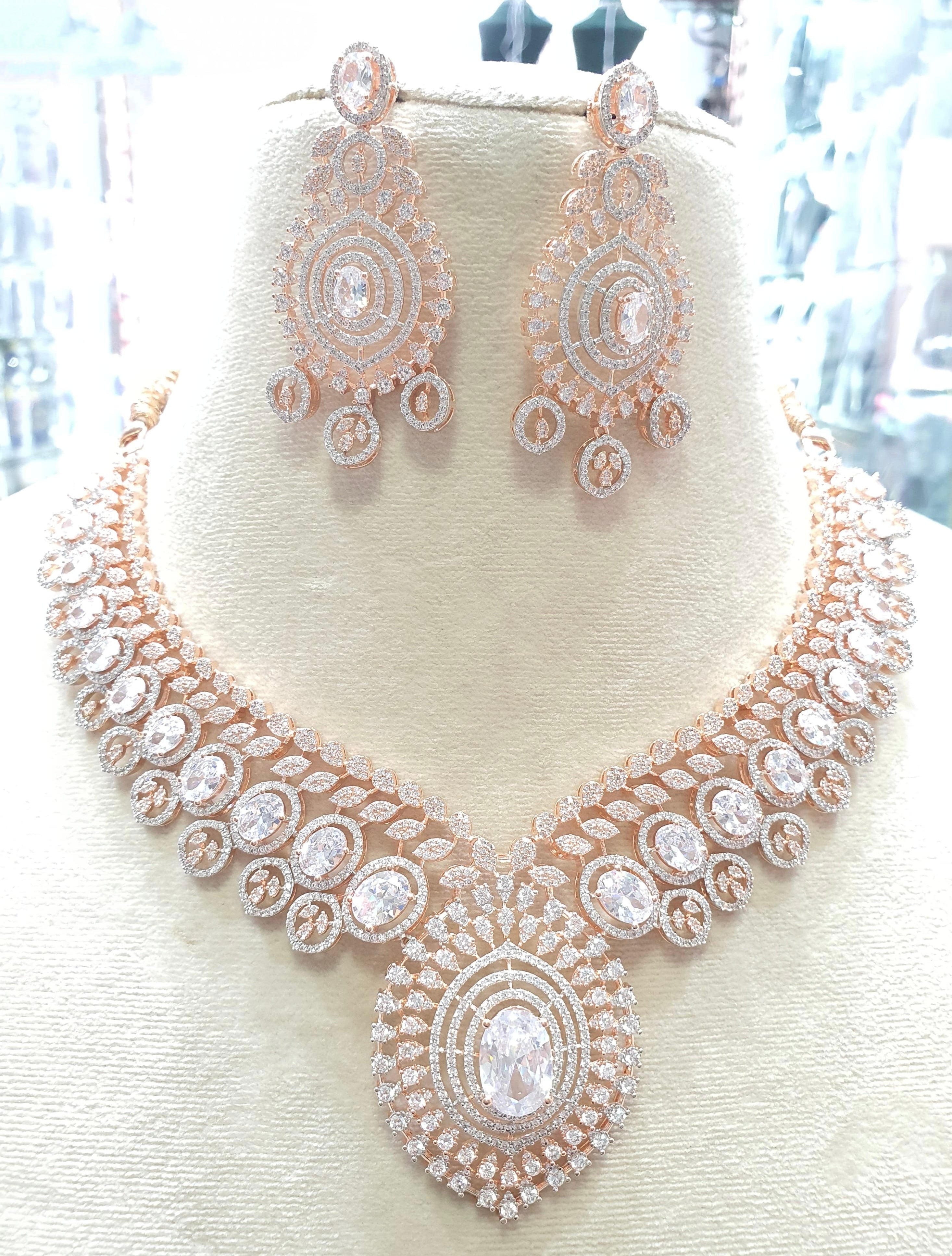 Rose gold necklace with clear stones and earrings