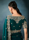 Designer bottle green tissue saree with cutwork detailing

