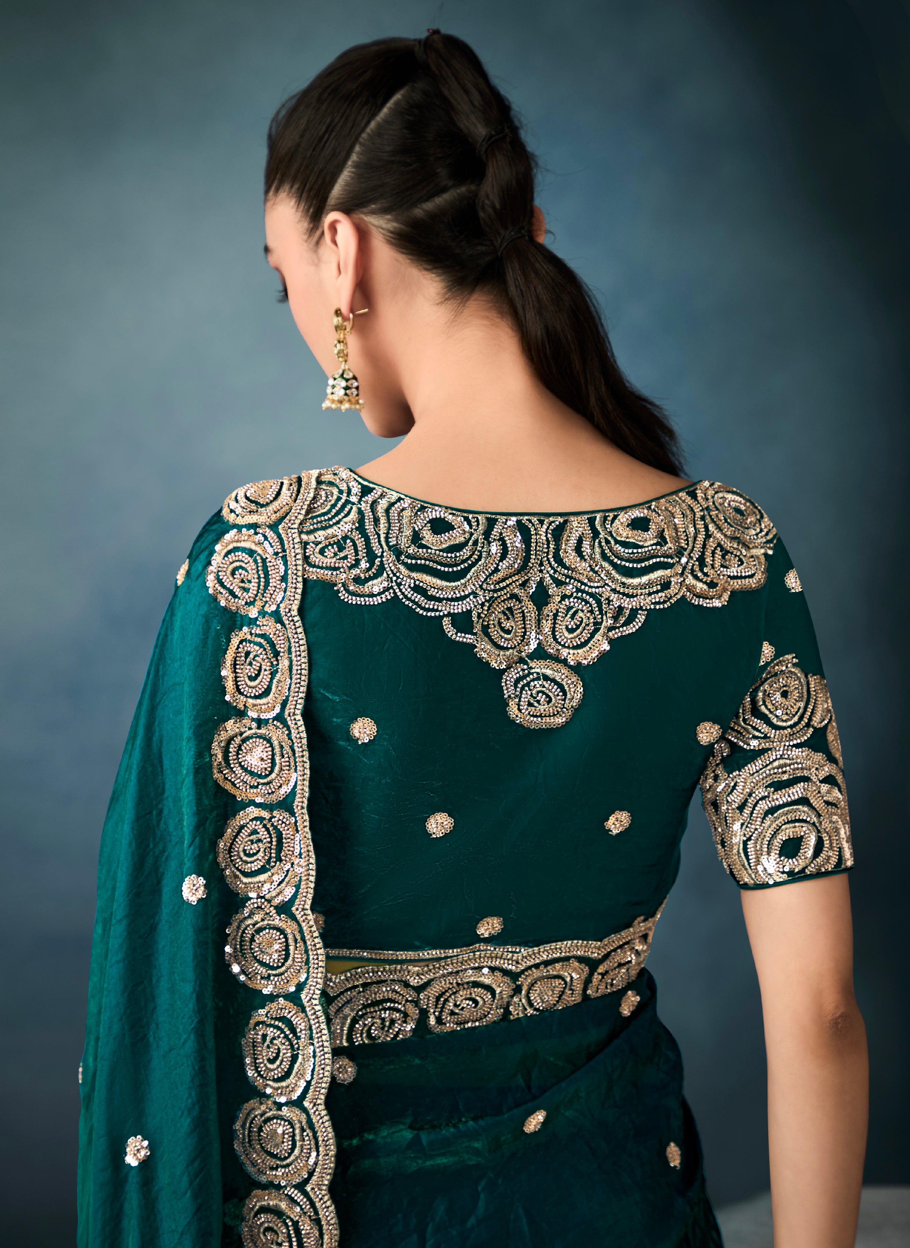 Designer bottle green tissue saree with cutwork detailing


