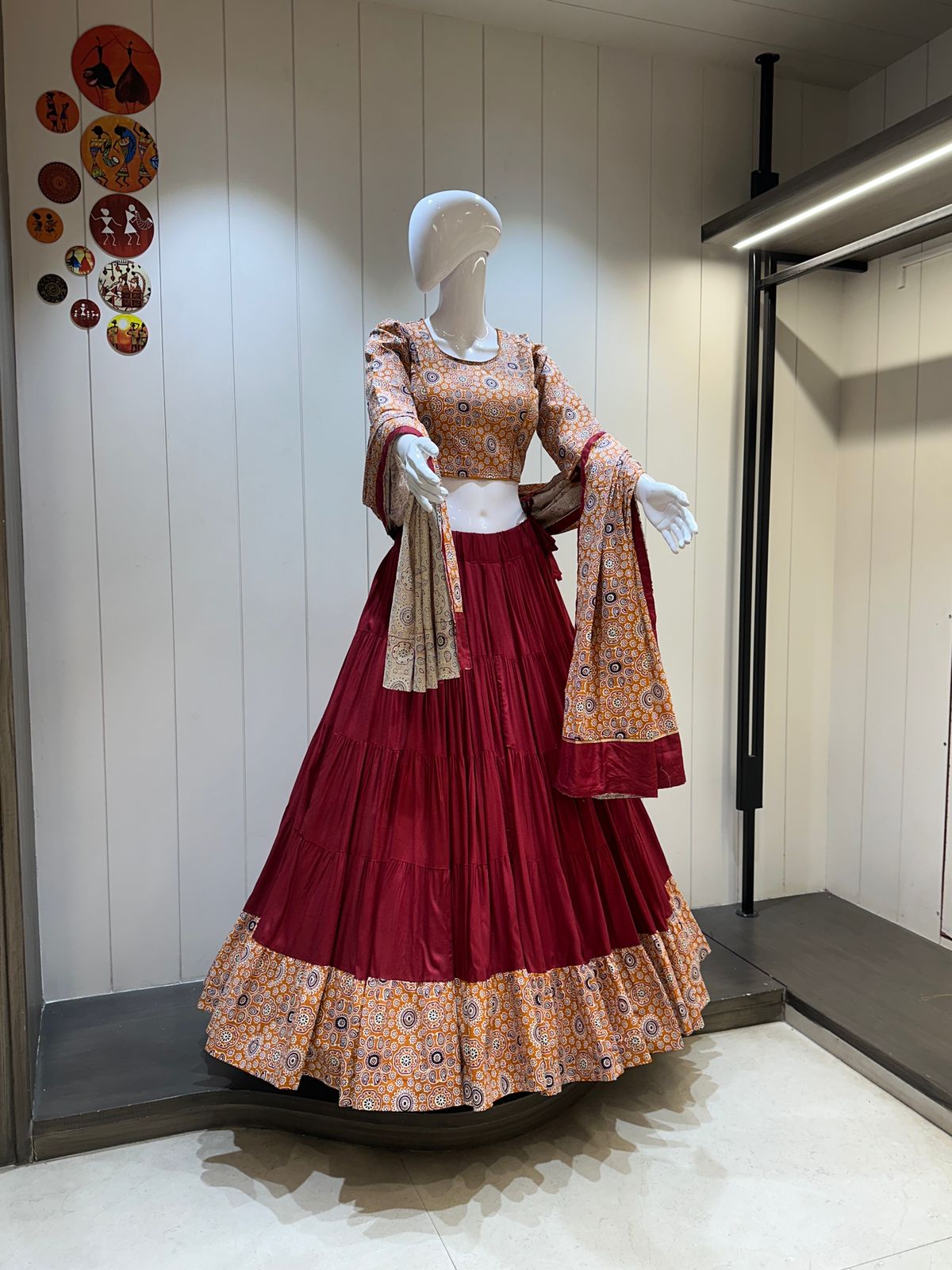 Front view of stitched rayon lehenga choli in maroon

