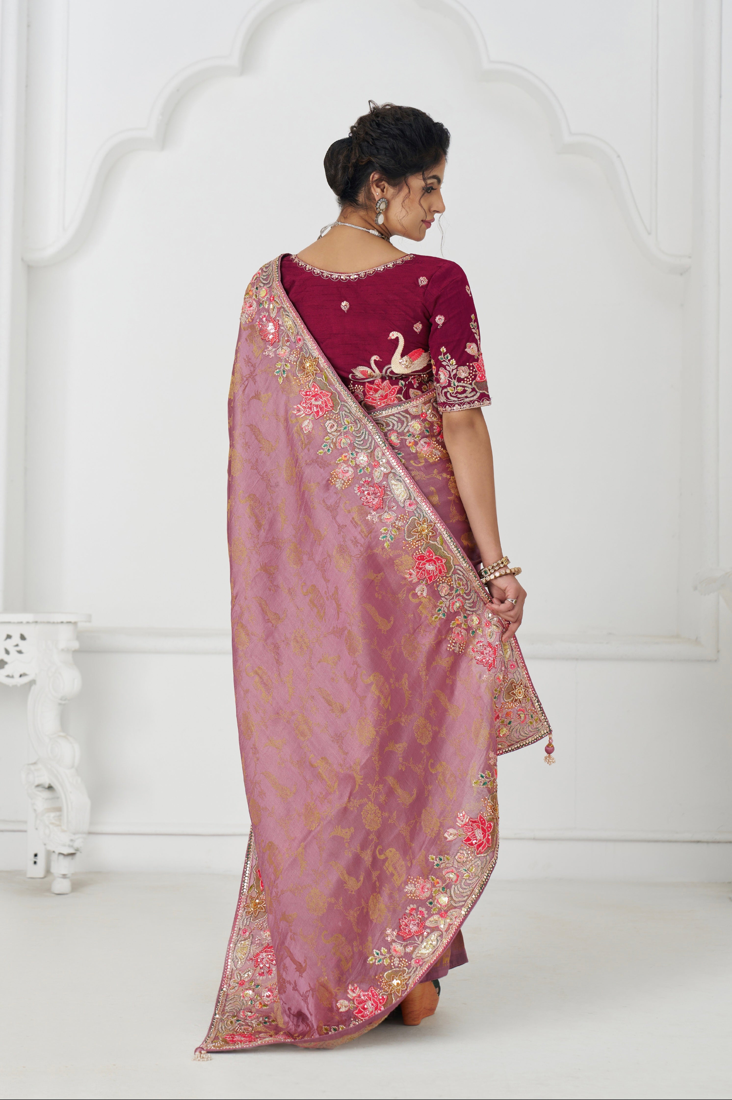Traditional pink embroidered saree for festive occasions