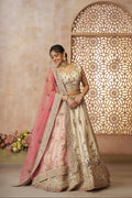 Elegant white bridal lehenga choli in zari silk with soft pink embroidered dupatta