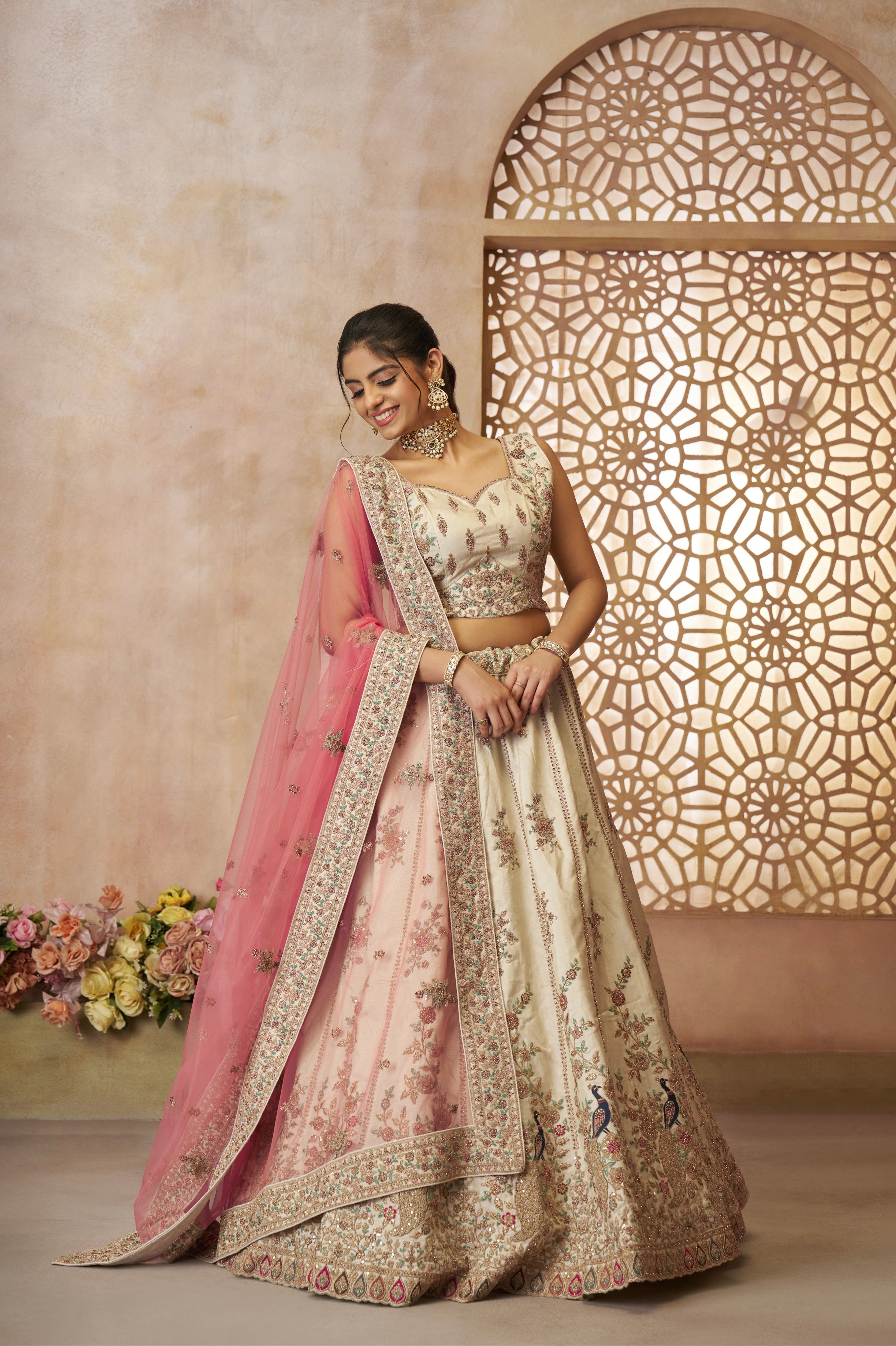 Elegant white bridal lehenga choli in zari silk with soft pink embroidered dupatta