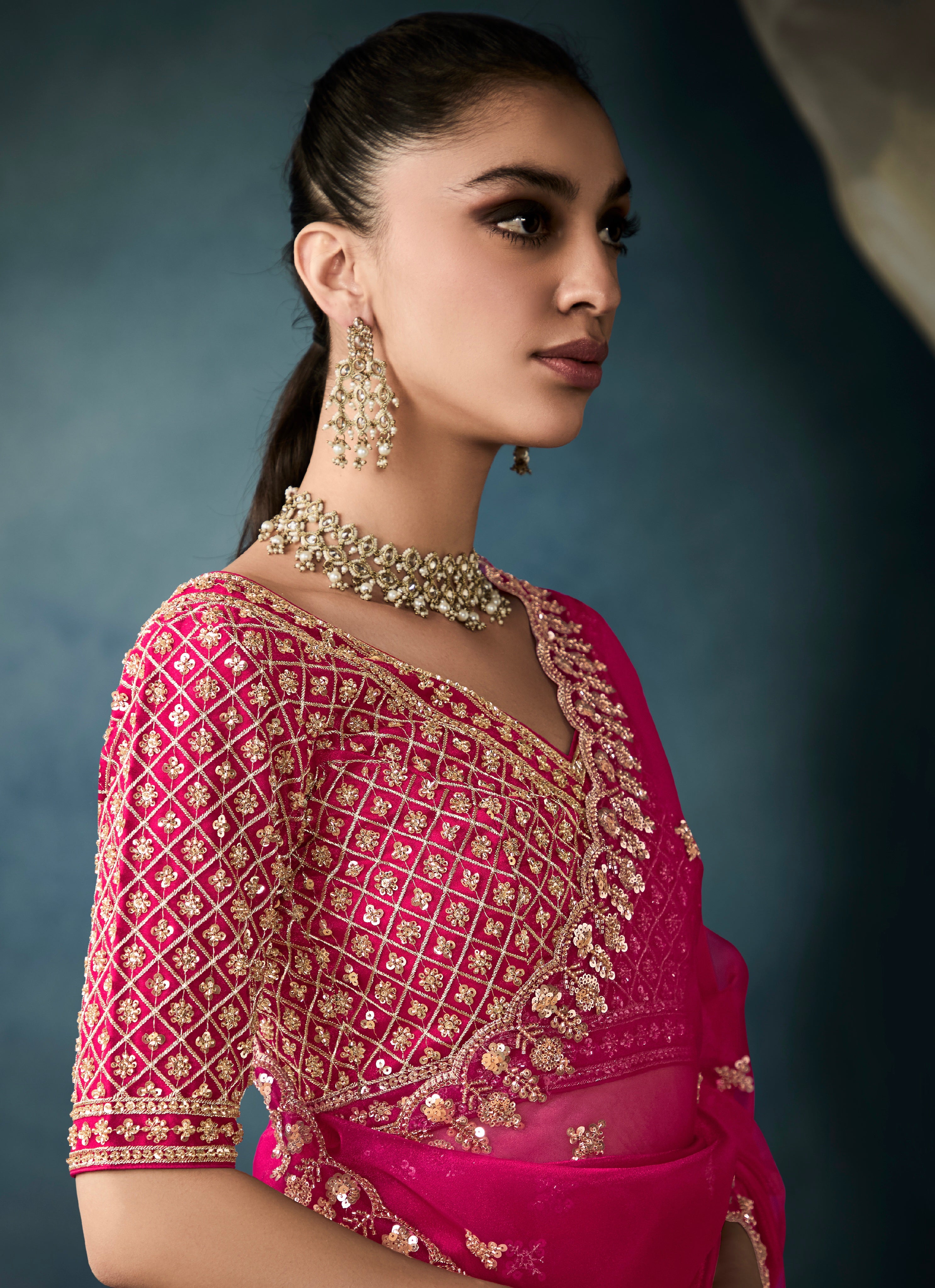 Party wear magenta tissue saree with intricate embroidery

