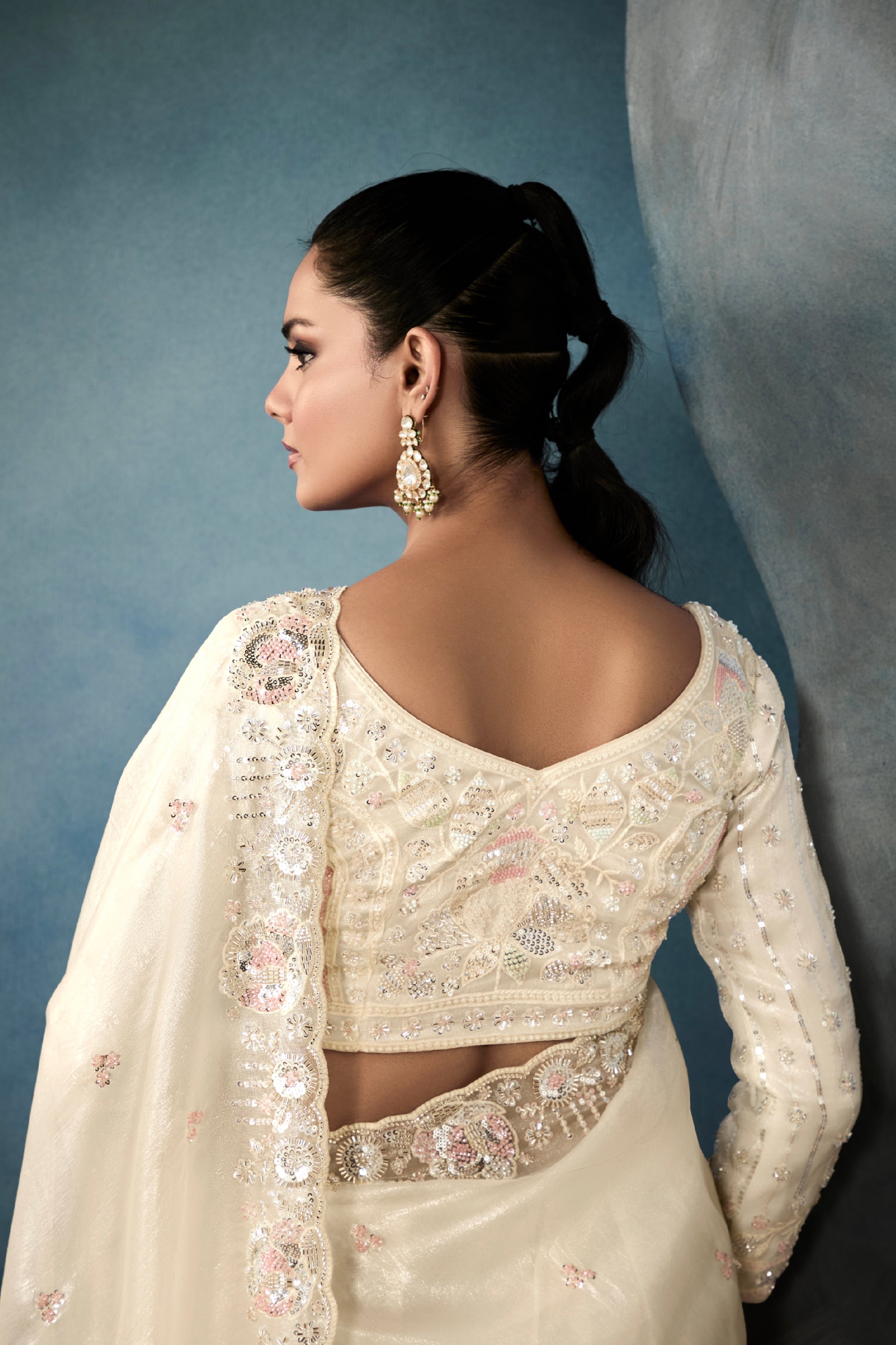 Designer off-white tissue saree for festive and party wear

