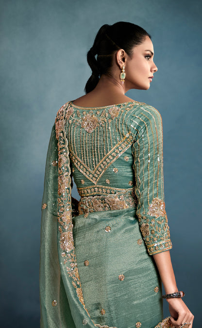 Festive wear sage green tissue saree for wedding