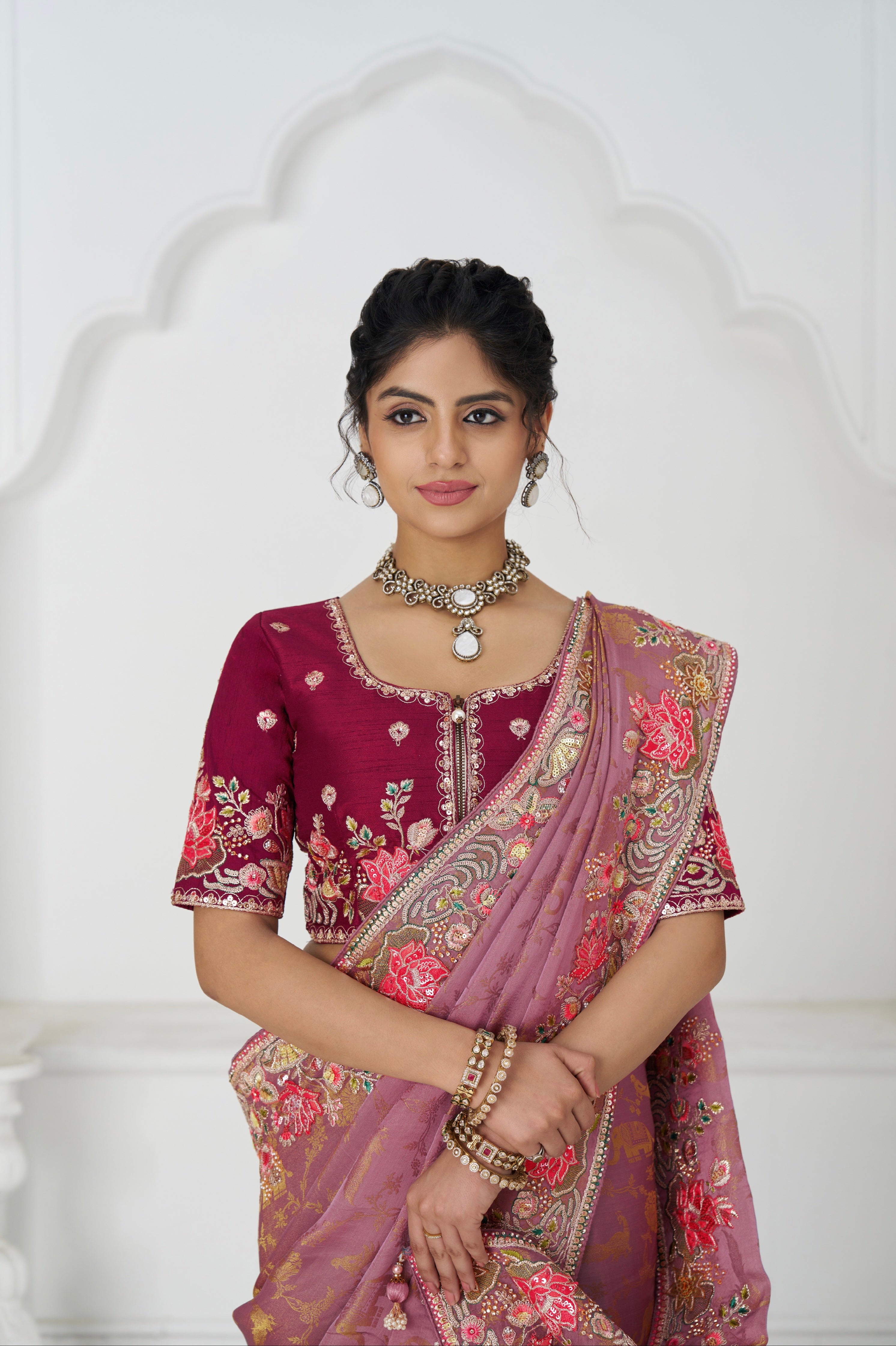 Elegant pink saree with paisley threadwork