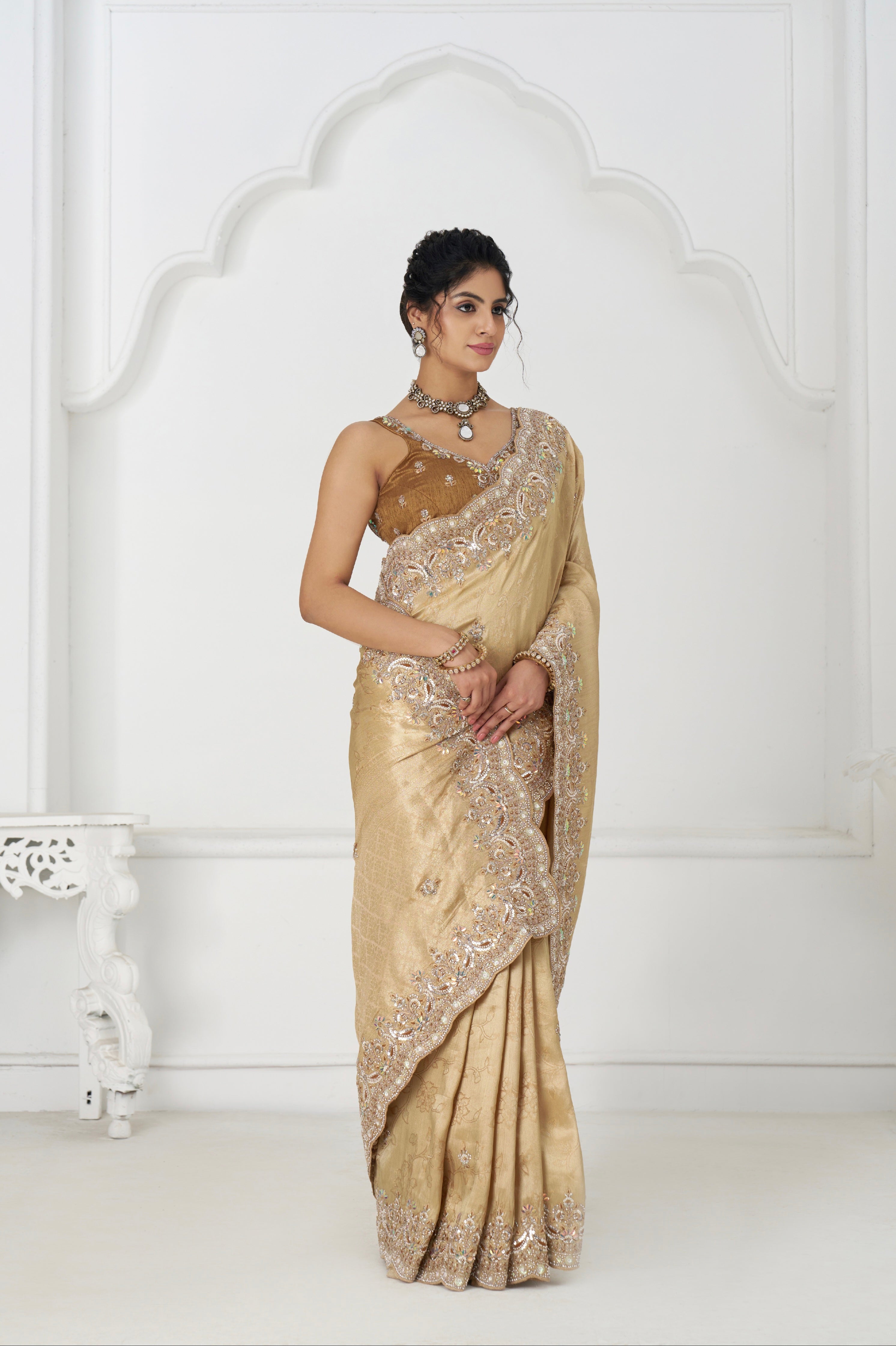 Golden viscose silk saree with embellished border and pallu