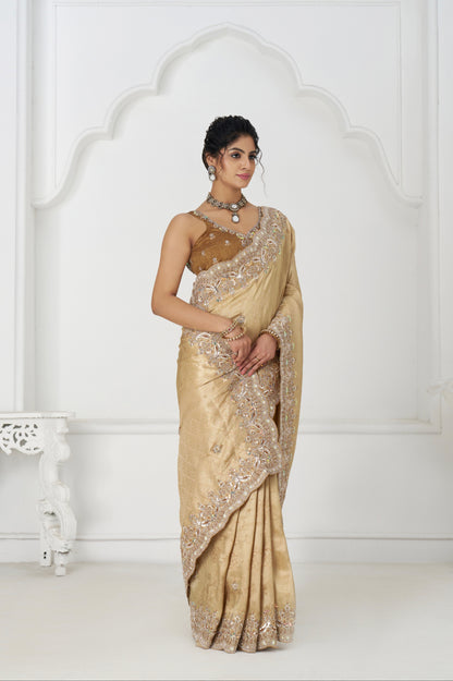 Golden viscose silk saree with embellished border and pallu