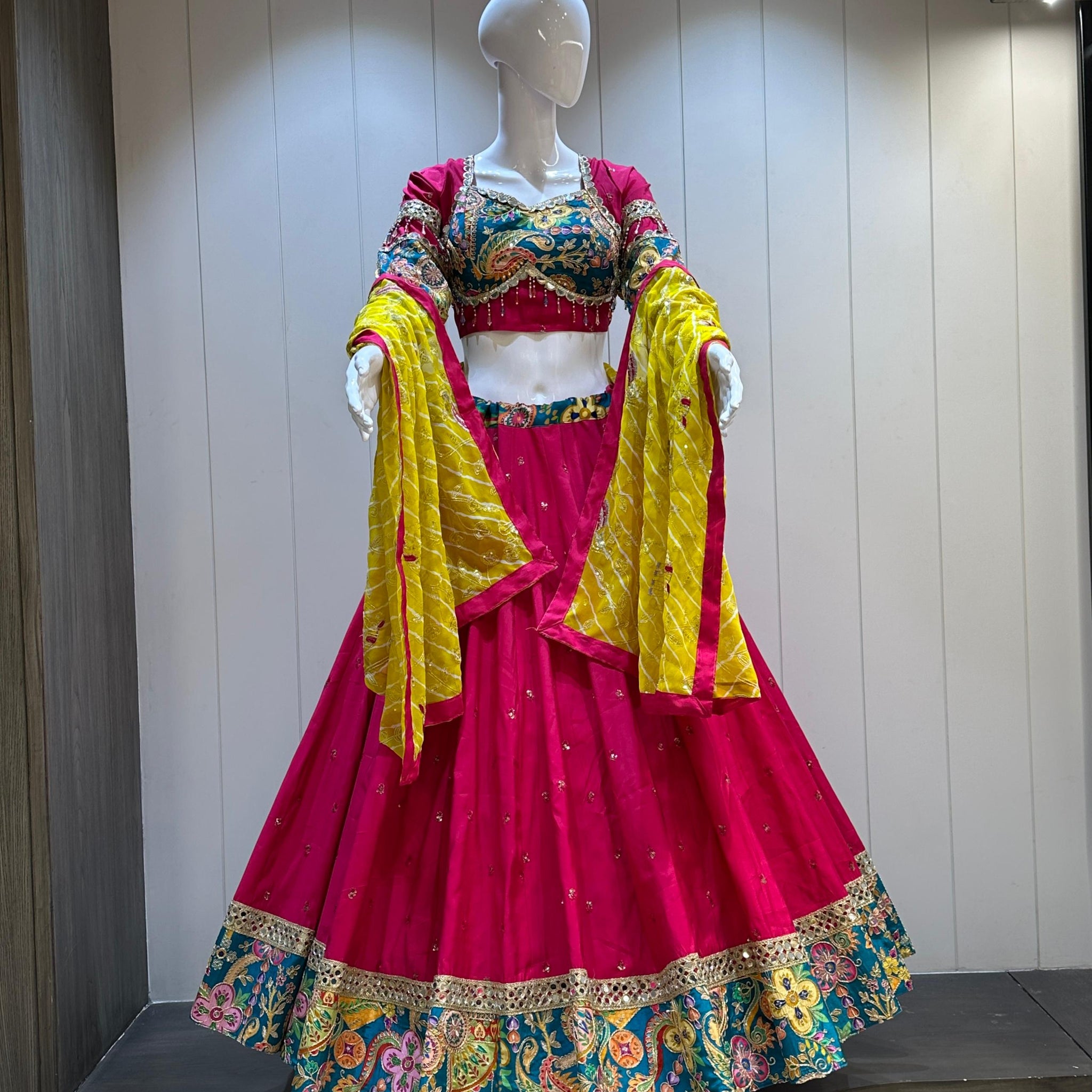 Hot pink chaniya choli with yellow dupatta

