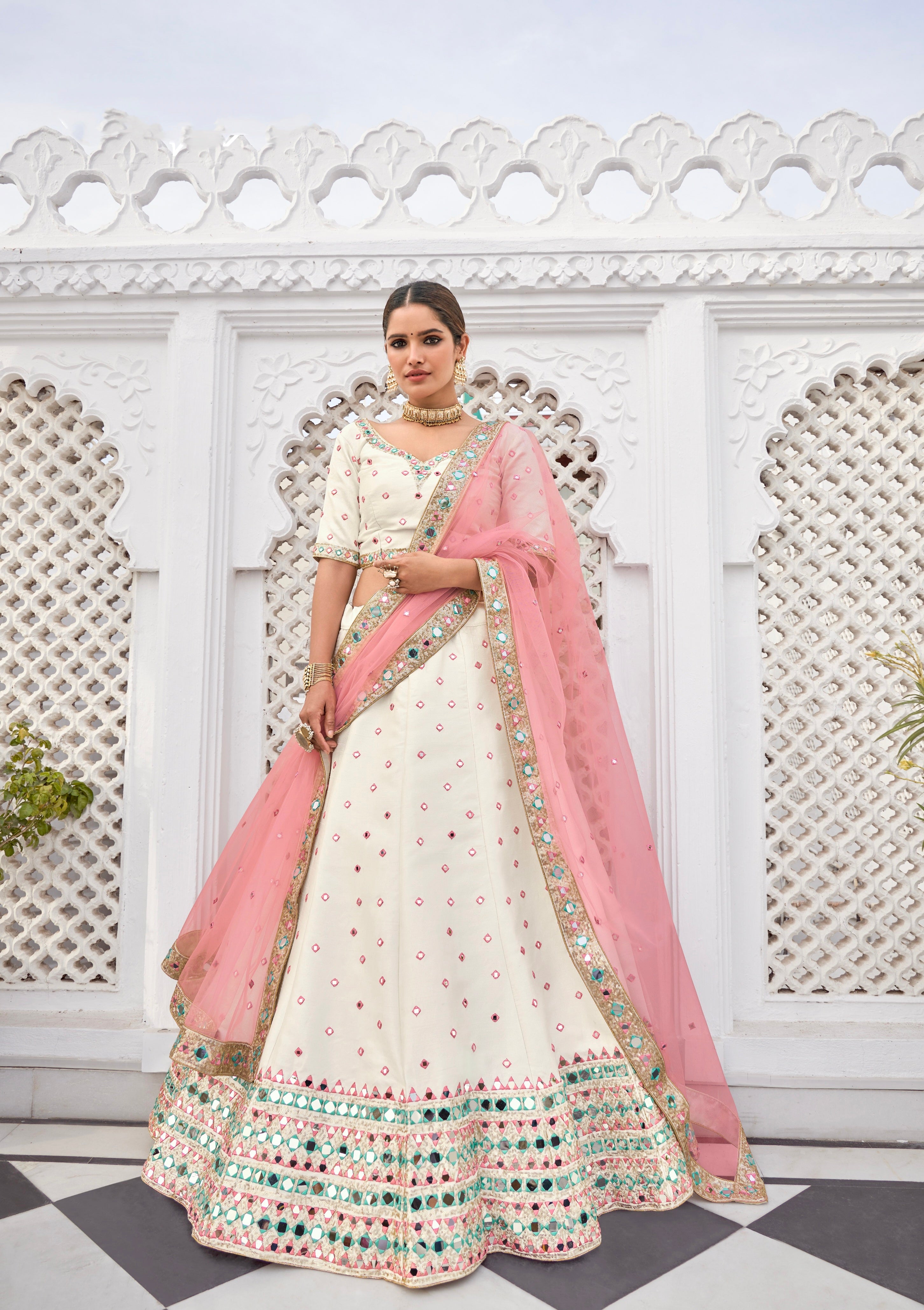 Ivory pink silk bridal lehenga with mirror embroidery and pink dupatta

