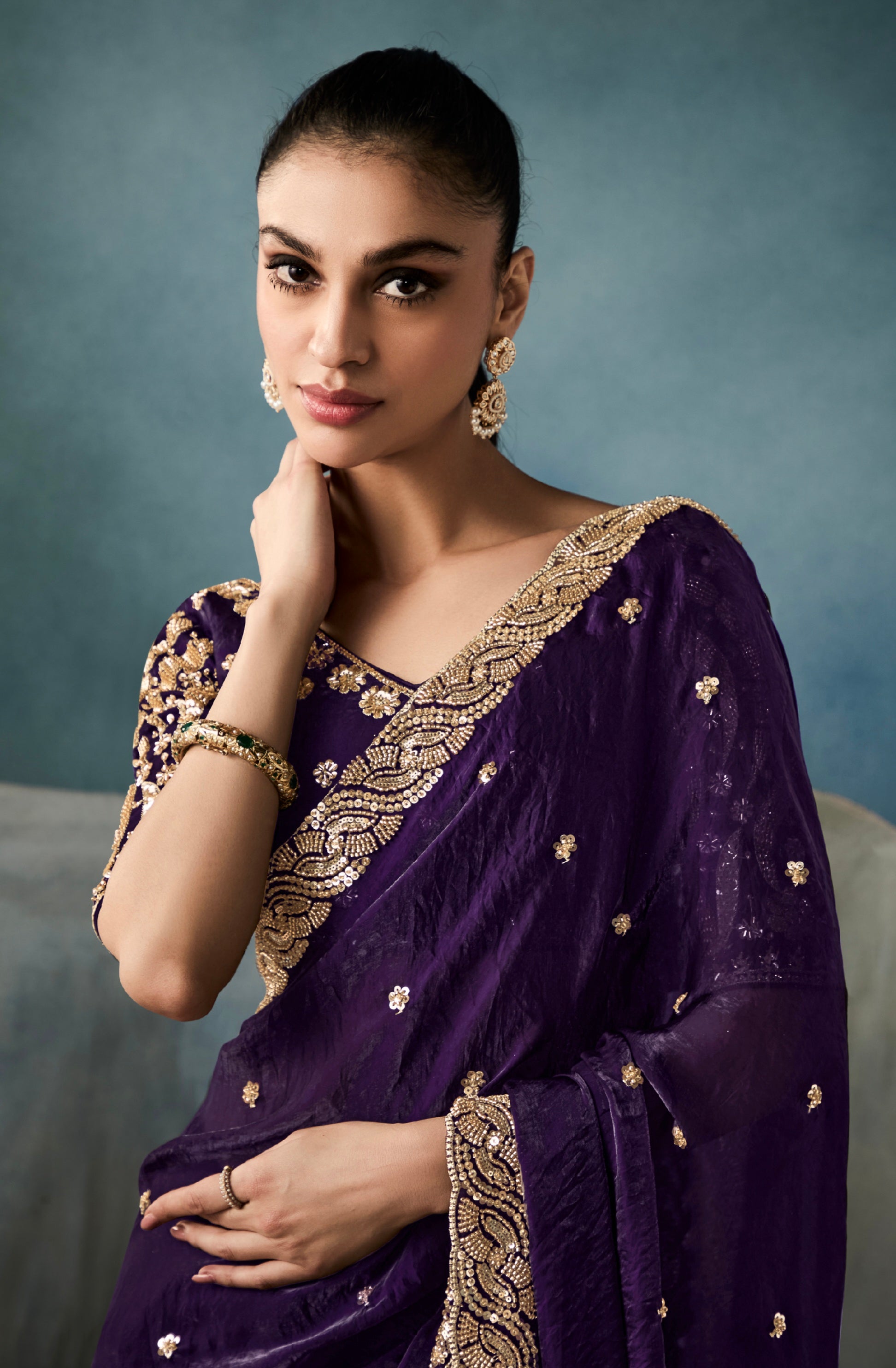 Luxury royal purple tissue saree with cutwork border for reception

