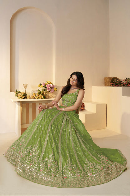 Front view of heavily embellished green bridal lehenga


