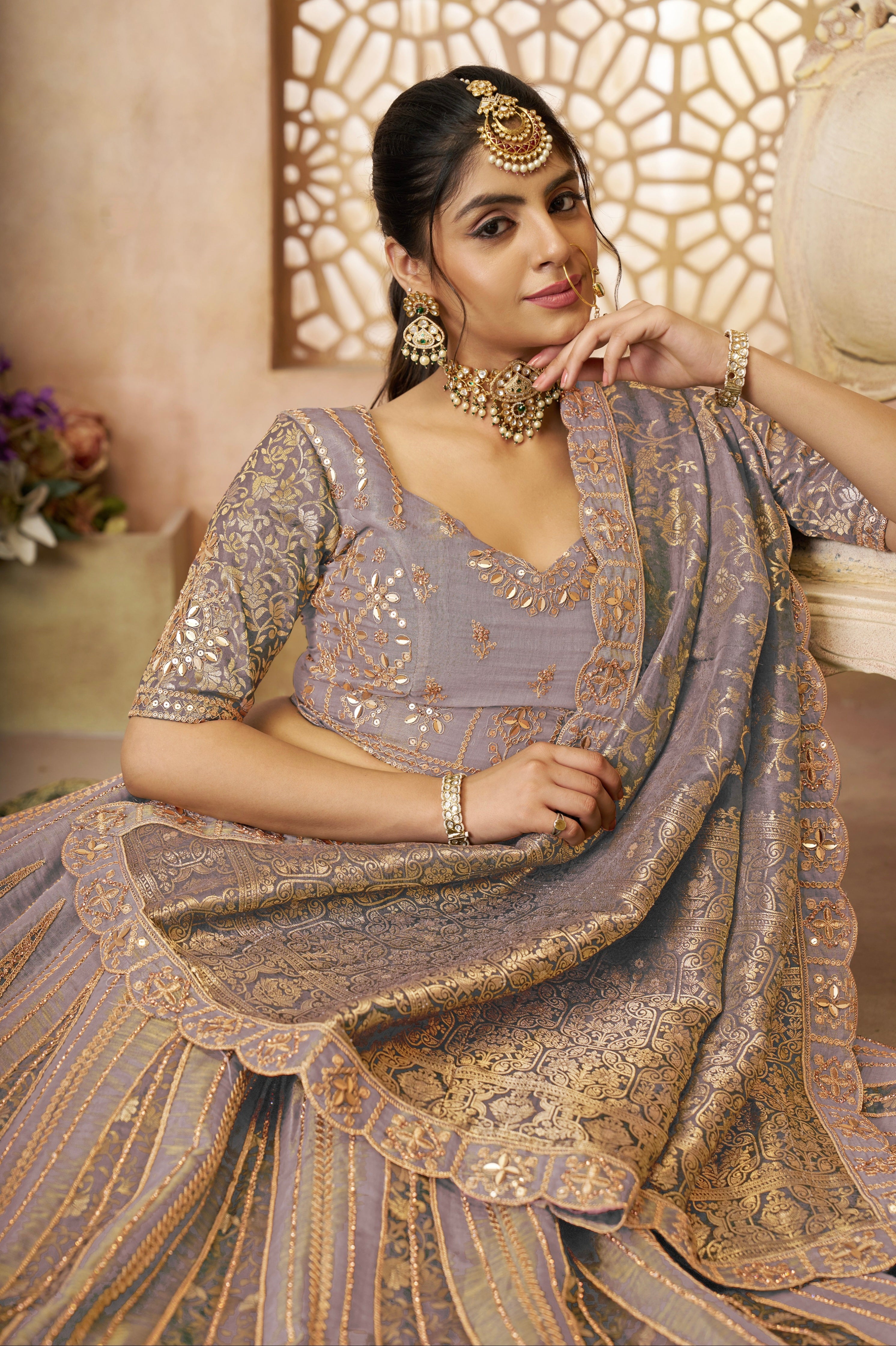 Pastel bridal lehenga with jacquard border detailing

