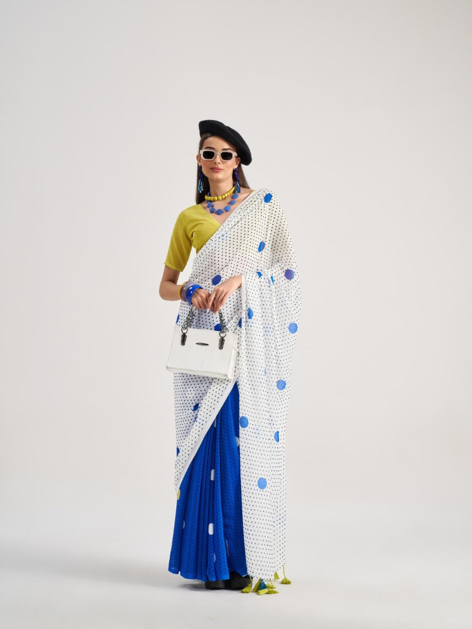 Royal blue and white georgette saree with blue dots

