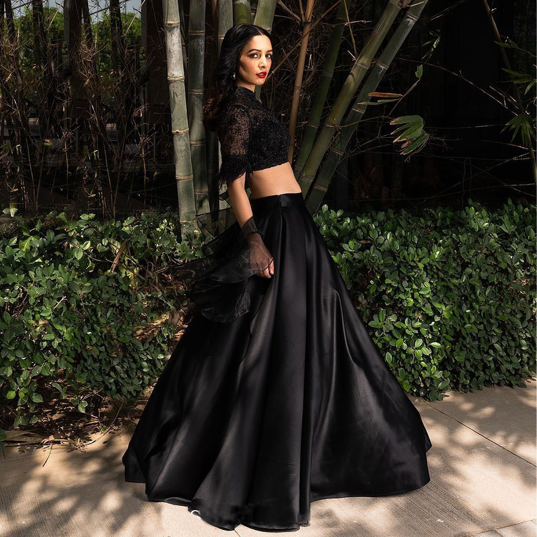 black color organza dupatta with a satin lehenga Anant Tex Exports Private Limited