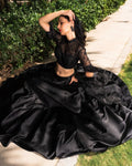 black color organza dupatta with a satin lehenga Anant Tex Exports Private Limited