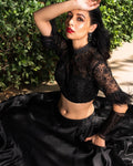 black color organza dupatta with a satin lehenga Anant Tex Exports Private Limited